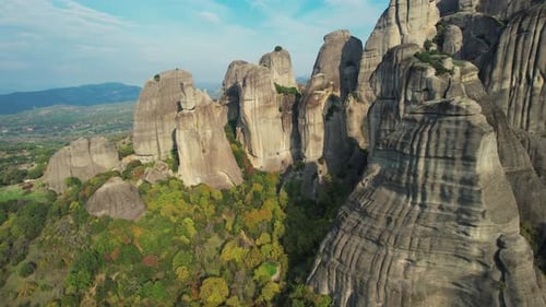 Scenic Greek Mountains. Meteora Aerial Footage At Golden Hour. Unesco Heritage Rock Formations
