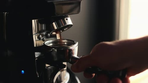 Dispensing Ground Coffee into Espresso Portafilter, Close Up