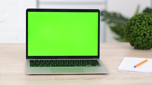 Laptop Notebook Computer with Green Screen Chroma Key on Work Table Close Up