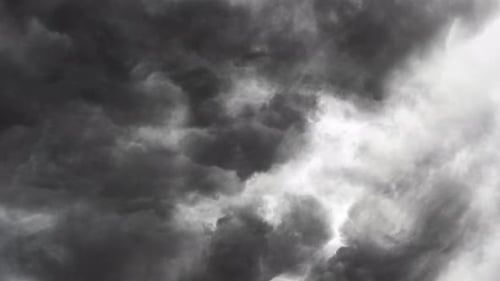 a flash of lightning in gray cloud