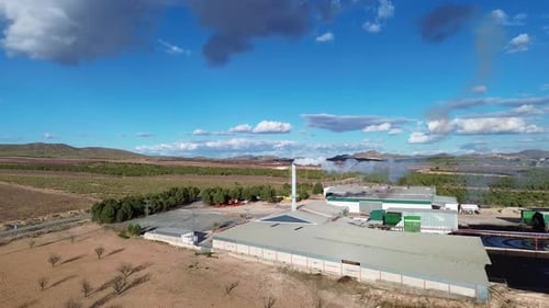 Factory emites smoke pollution contamination on a windy day in Spain