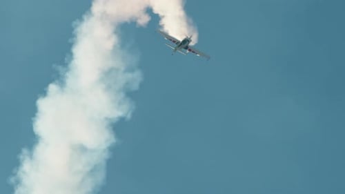 Stunt Plane with White Smoke Trail