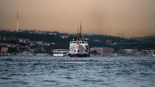 Boat on Water with Cityscape at Sunset