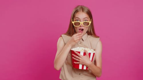 Enthusiastic Woman Eating Popcorn with 3D Glasses