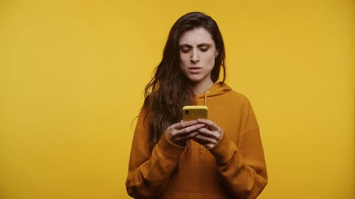 Woman Using Smartphone Looking Upset