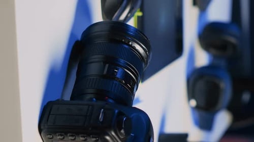 Vertical Video Professional Camera Equipment in Empty Blue Neon Lit Creative Photography Studio