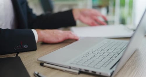 Office Worker Writing on Laptop