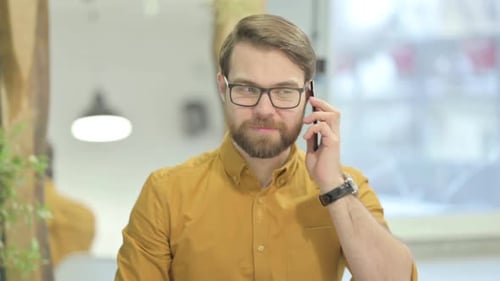 Young Man Talking on Phone