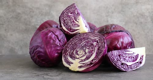 Pile of Fresh Cut and Whole Red Cabbage