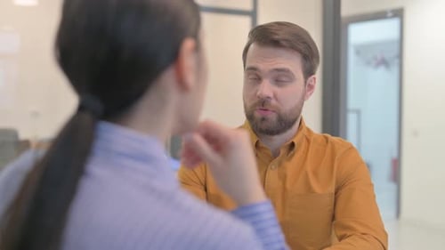 Close up of Businessman Talking with Teammates