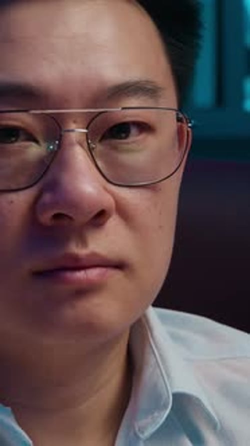 Close Up of Serious Man Wearing Glasses