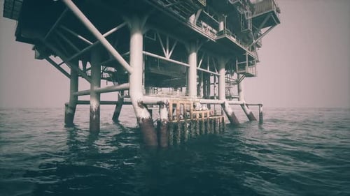 Old Oil Platform Submerged in Calm Waters During an Overcast Day