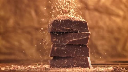 The Grated Chocolate Falls on the Chocolate Slices Filmed on a Highspeed Camera at 1000 Fps