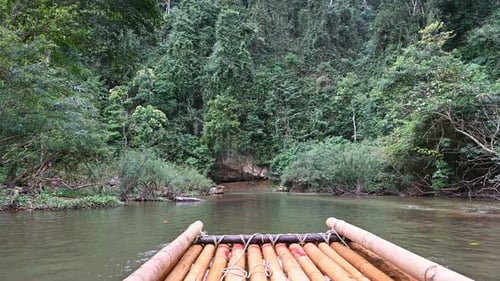 Bamboo rafting on a mountain river among the jungles of Thailand