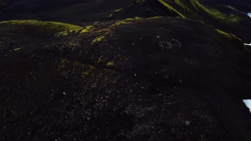 Aerial drone view of people hiking on a mountain trail, on Iceland highlands