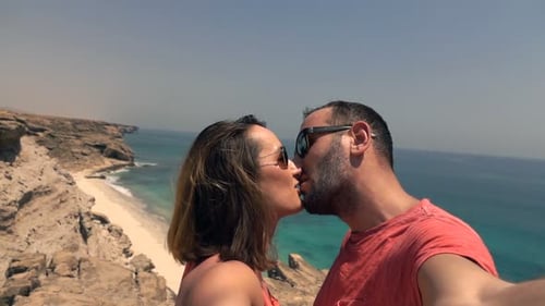 Couple Recording Video, Taking Selfie While Kissing on Cliff, Super