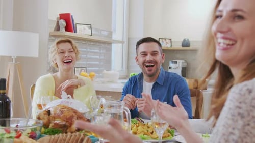 Waist Up Portrait View of the Multi Generation Family Sitting at the Dining Table During Festive