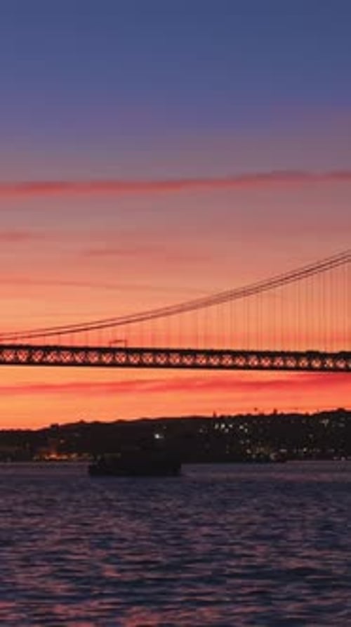 View of 25 De Abril Bridge Over Tagus River on Sunset Lisbon Portugal