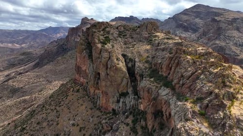 Aerial view of rock formations and mountains in desert, United States.