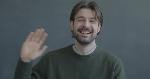 Smiling Man Waving Hello