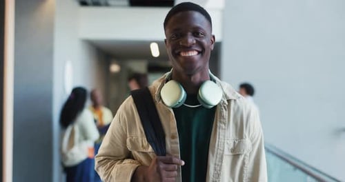 Face, laughing and man with headphones, college and happy for education