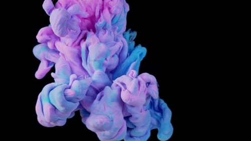 Magic Mixing of Color Cloud of Silky Ink in Water Isolated on Black Background Colorful Ink in Water