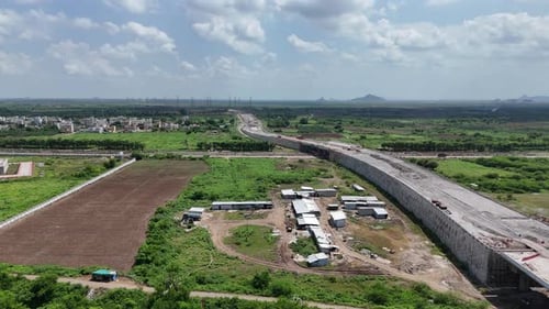 Highway stretching through the green plains of Amaravathi, filmed from above.