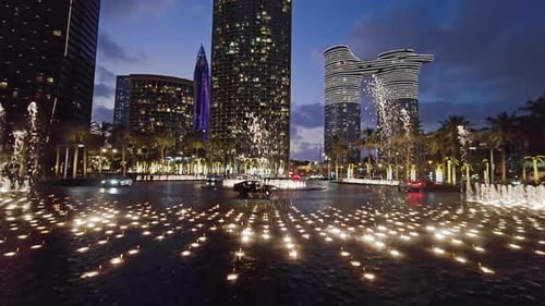 Nighttime Fountain Display in Urban Dubai Setting Captivating Nighttime View of a Dynamic Fountain