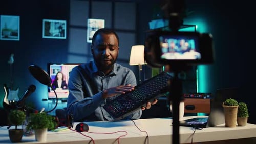 Man Reviews Keyboard in Apartment Studio