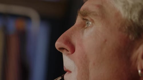 Applying Facial Makeup with a Brush Close Up