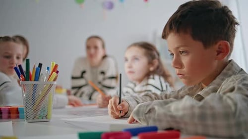 Diligent Pupil Drawing Pencil in School Closeup Focused Boy Creating Picture