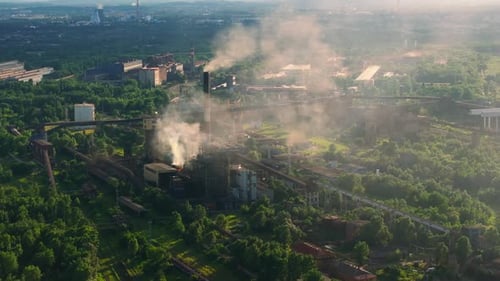 Aerial view of coal power plant high pipes with black smoke