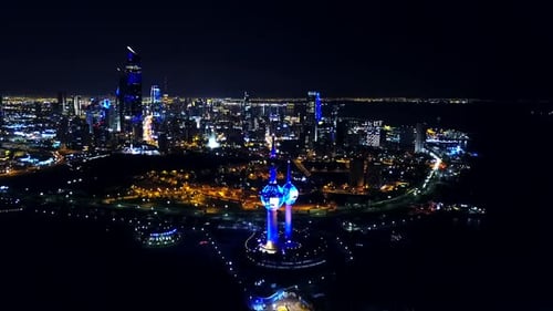 Cinematic Panoramic View of the Waterfront of Kuwait City at Night. Slow 4K Panning shot.