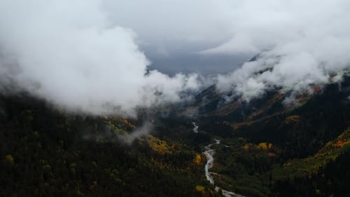 Aerial View Of Gorge With Valley And Mountains In Cloudy Gloomy Weather Cinematic Slow Motion