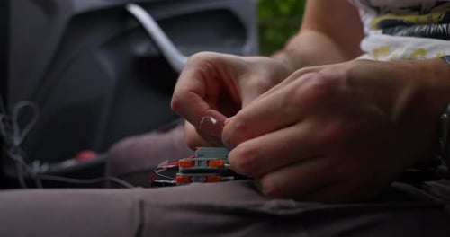Close-up of person assembling tiny electronic components