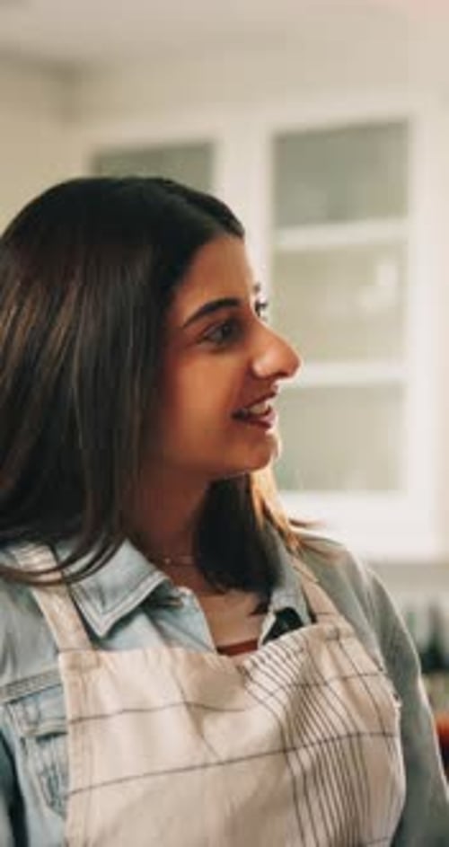 Couple Cooking Together in Bright Kitchen