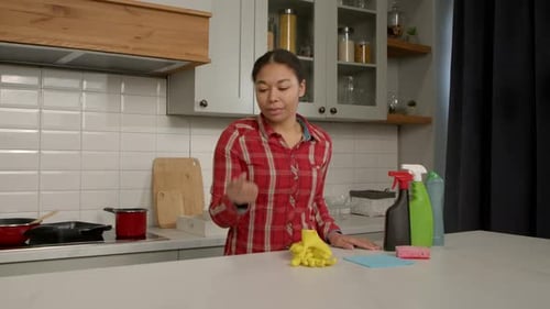 Cheerful Pretty African American Woman Checking Cleanliness After Cleanup