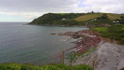 Secluded beach and bay once used by Smugglers. Talland Bay and Smugglers Rest beach in Cornwall, Eng