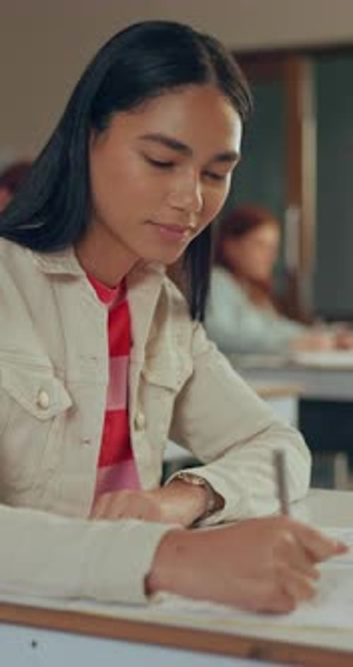 Girl, thinking and writing in high school with pen for math assignment, study or workbook activity