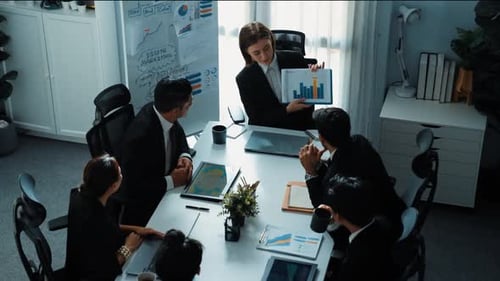 Top view of manager show increase sales chart while team clap hand. Directorate.