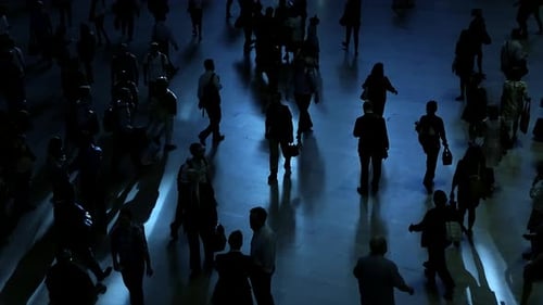Overhead view of anonymous commuters walking in a city