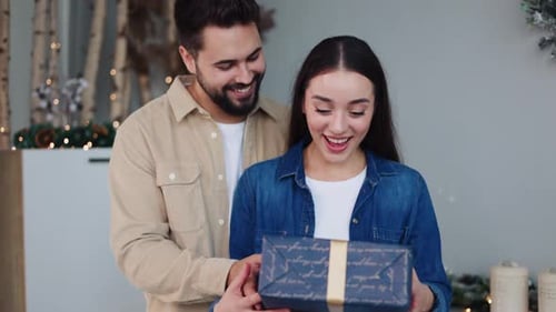 Happy Couple Celebrate with Holiday Gift