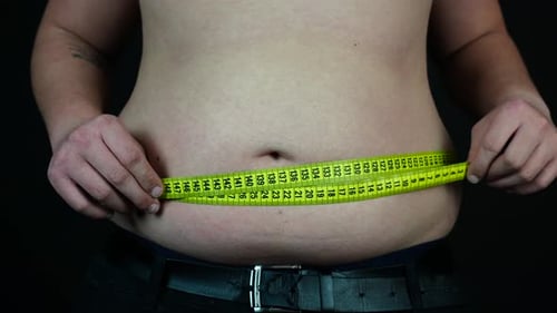 Overweight Man Measuring His Naked Belly. Obesity Overweight Concept, Close Up