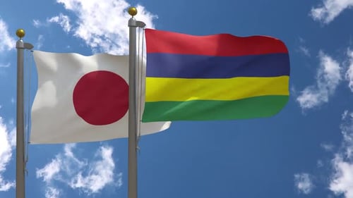 Japan and Mauritius National Flags Waving in Blue Sky