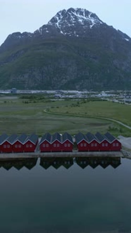 Aerial View of Red Cabins in Mountain Landscape