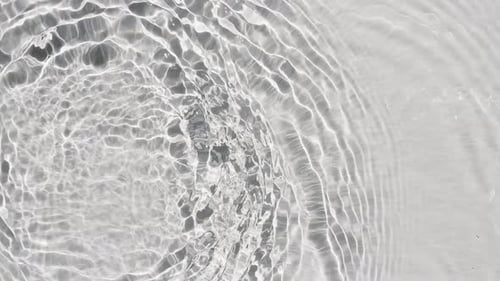 Pure Beige Water with Reflections Sunlight in Slow Motion Water Surface Texture Top View Sun and