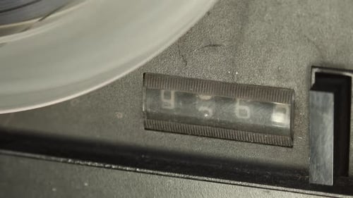 Rewinding tape recorder, closeup view of counter with spinning numbers