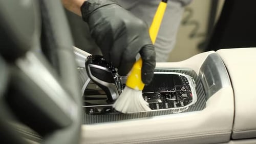 Car Wash Services Cleaning the Car with a Brush