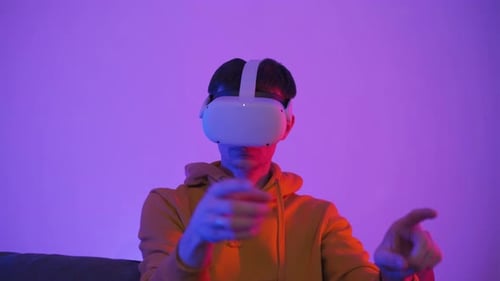 Young Adult Playing Virtual Reality at Night