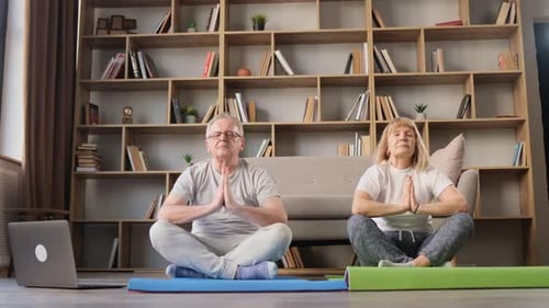 Senior Couple Meditating Together at Home